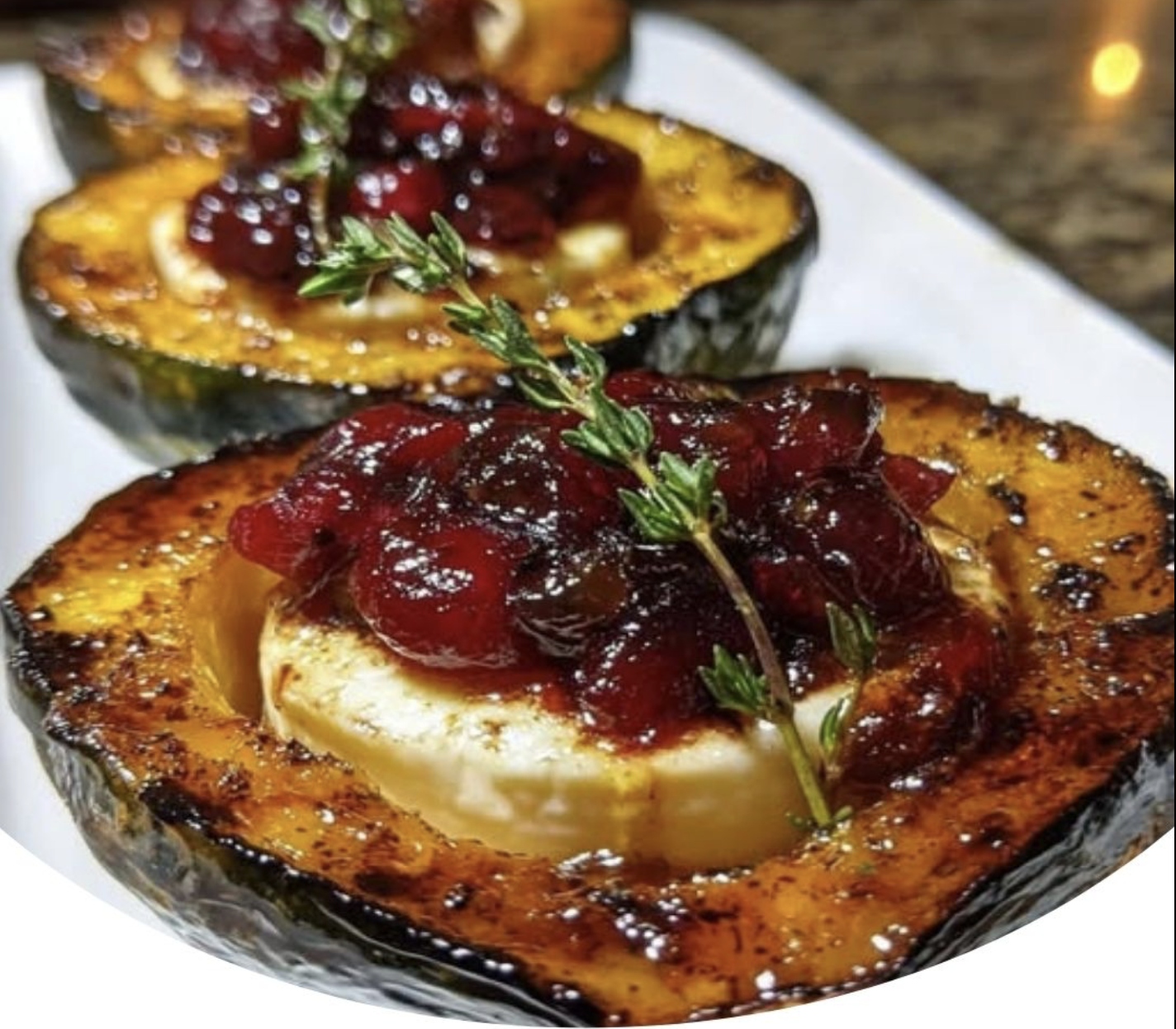 Honey-Glazed Acorn Squash with Creamy Goat Cheese and Cranberry Drizzle