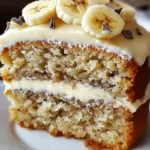 A delicious plate of Banana Bread Cake with Cream Cheese Frosting 🍌🍰🧁