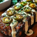 A delicious plate of Smoky Jalapeño Popper Meatloaf with Creamy Ranch Drizzl